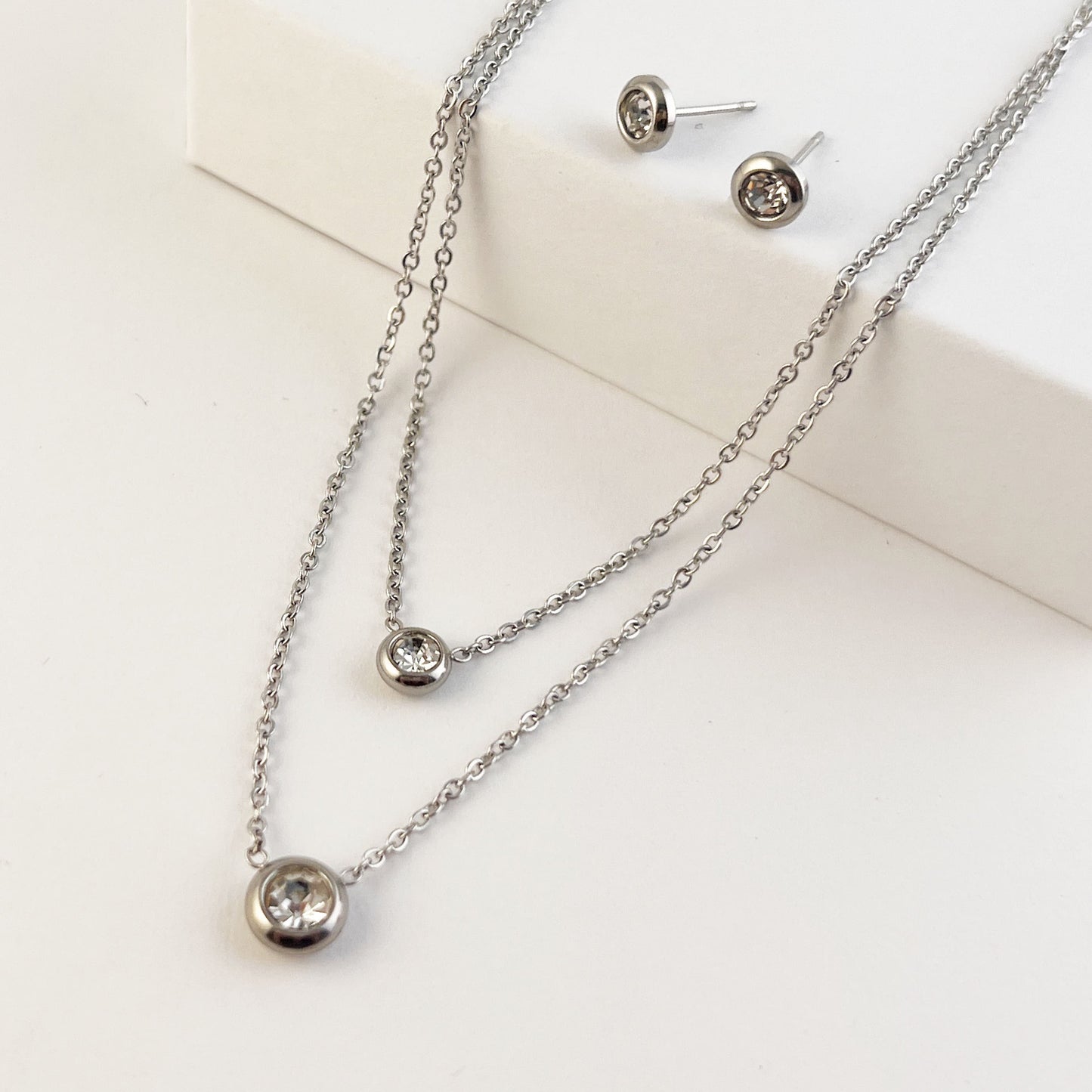 Set arete y collar doble acero inoxidable cristal redondo bisel