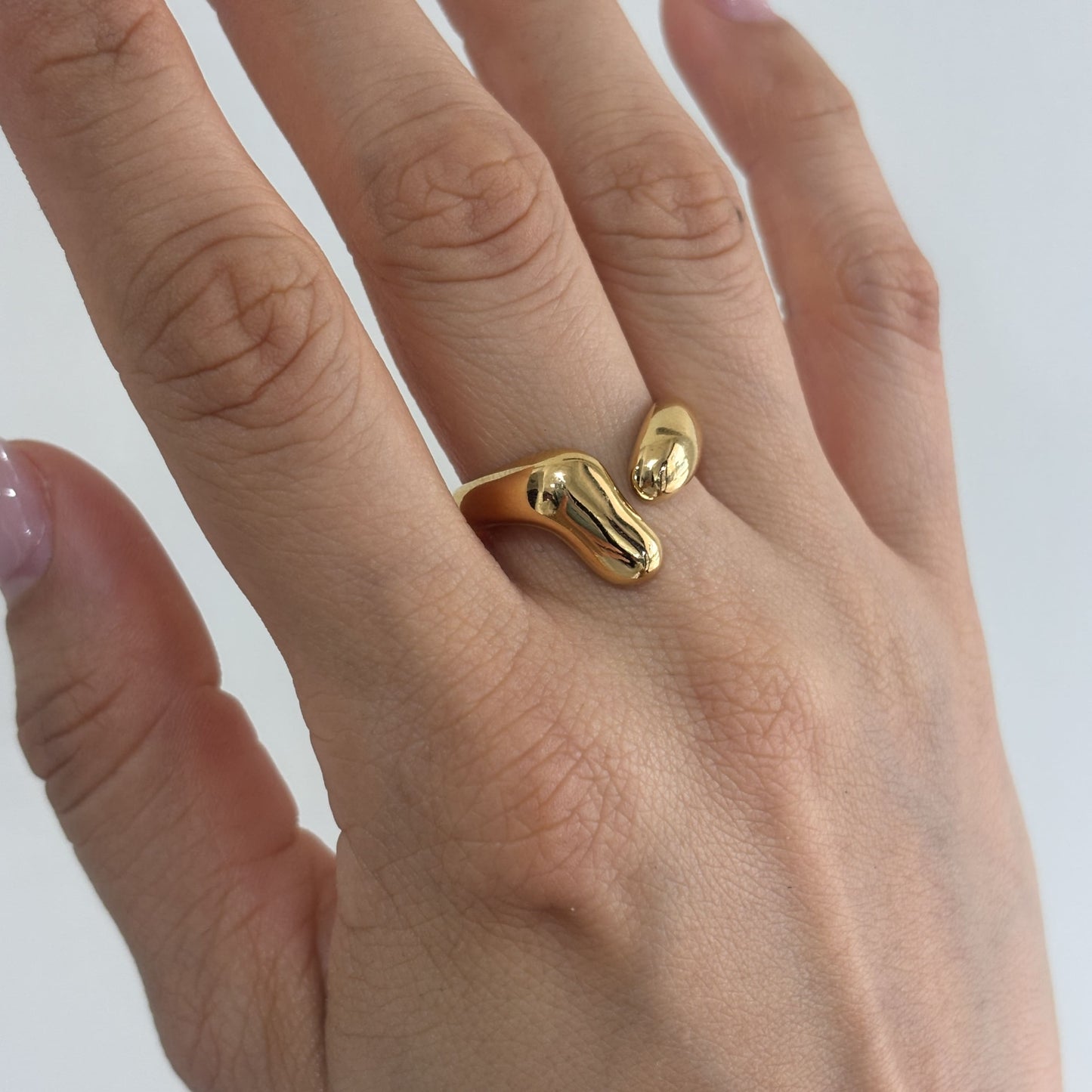 Anillo acero inoxidable abierto irregular dorado