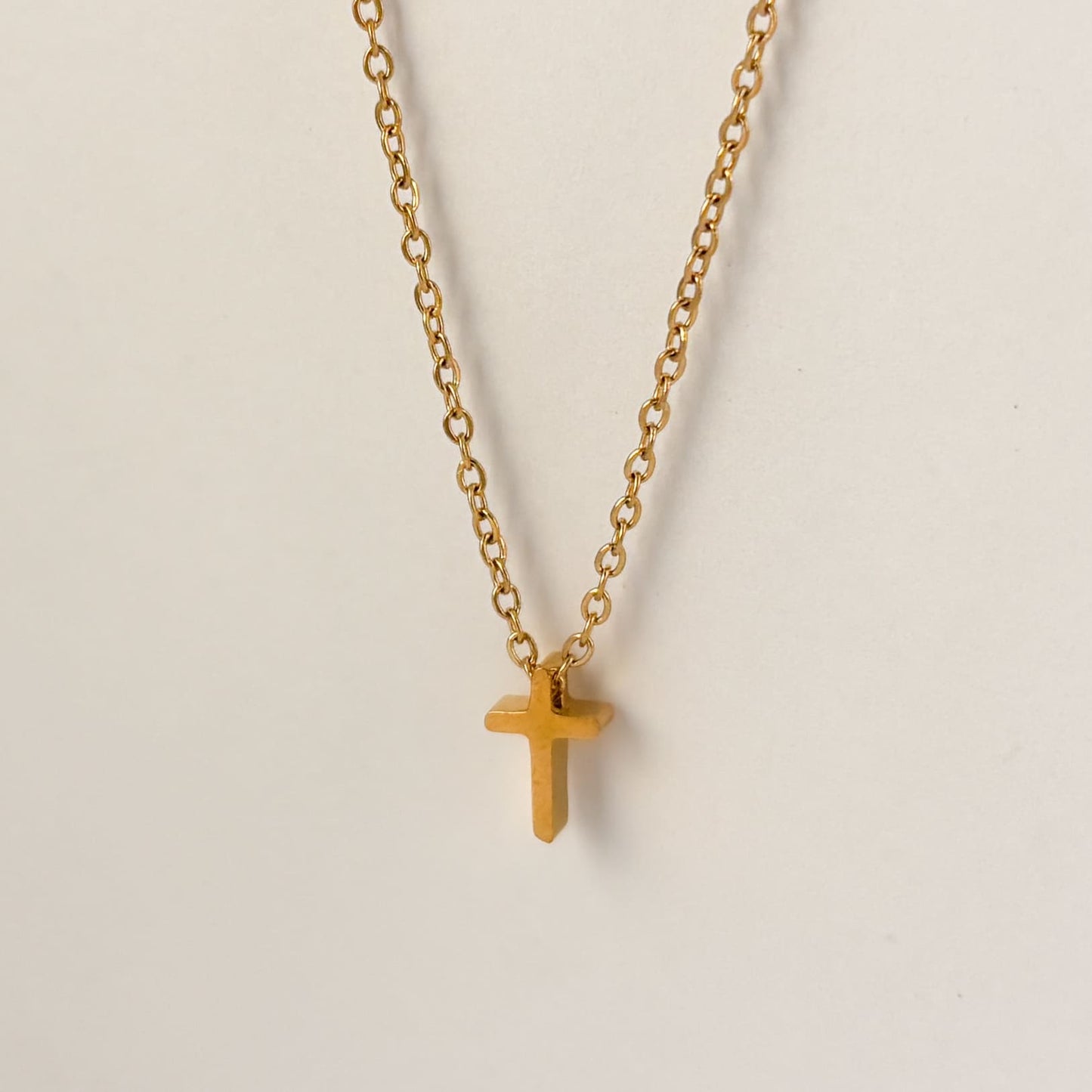 Collar cruz mini acero inoxidable dorado