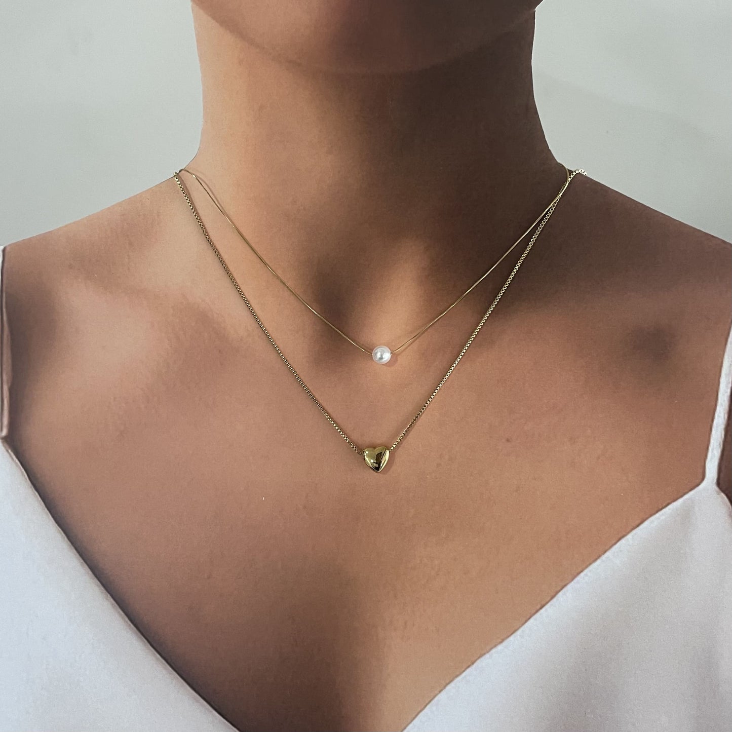 Collar doble acero inoxidable perla y corazón dorado