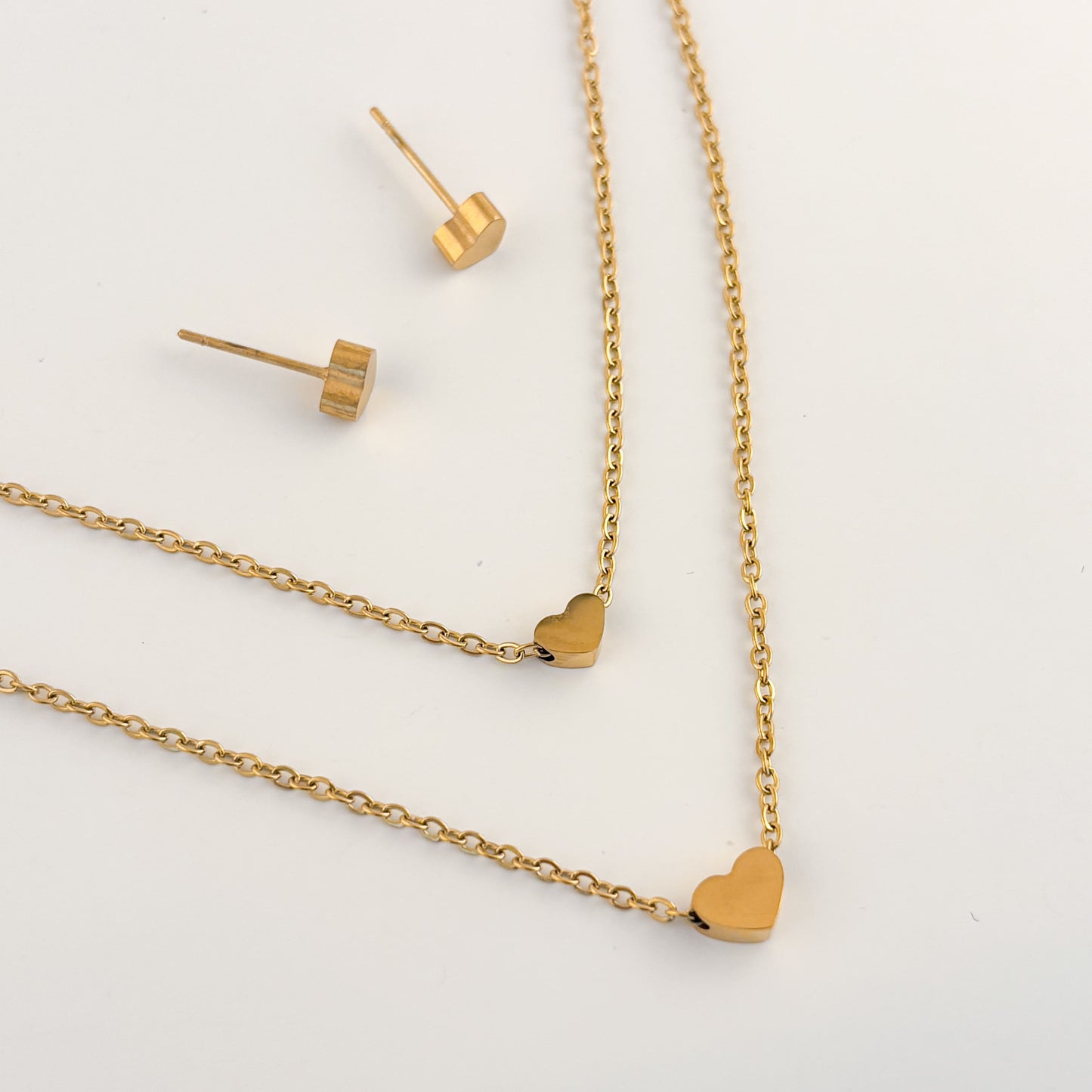Set acero inoxidable aretes y collar doble corazón mini dorado