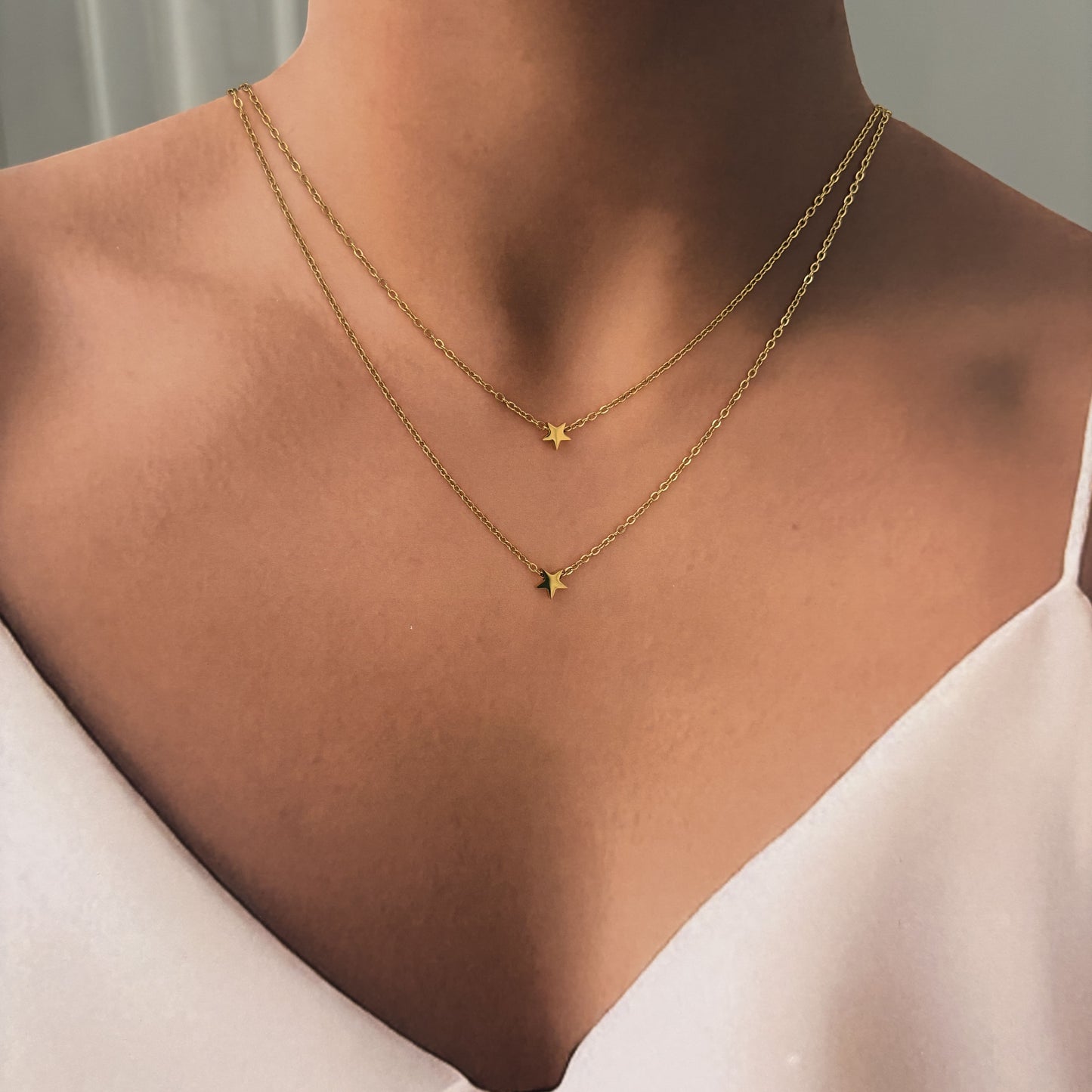 Set acero inoxidable aretes y collar doble estrella en dorado