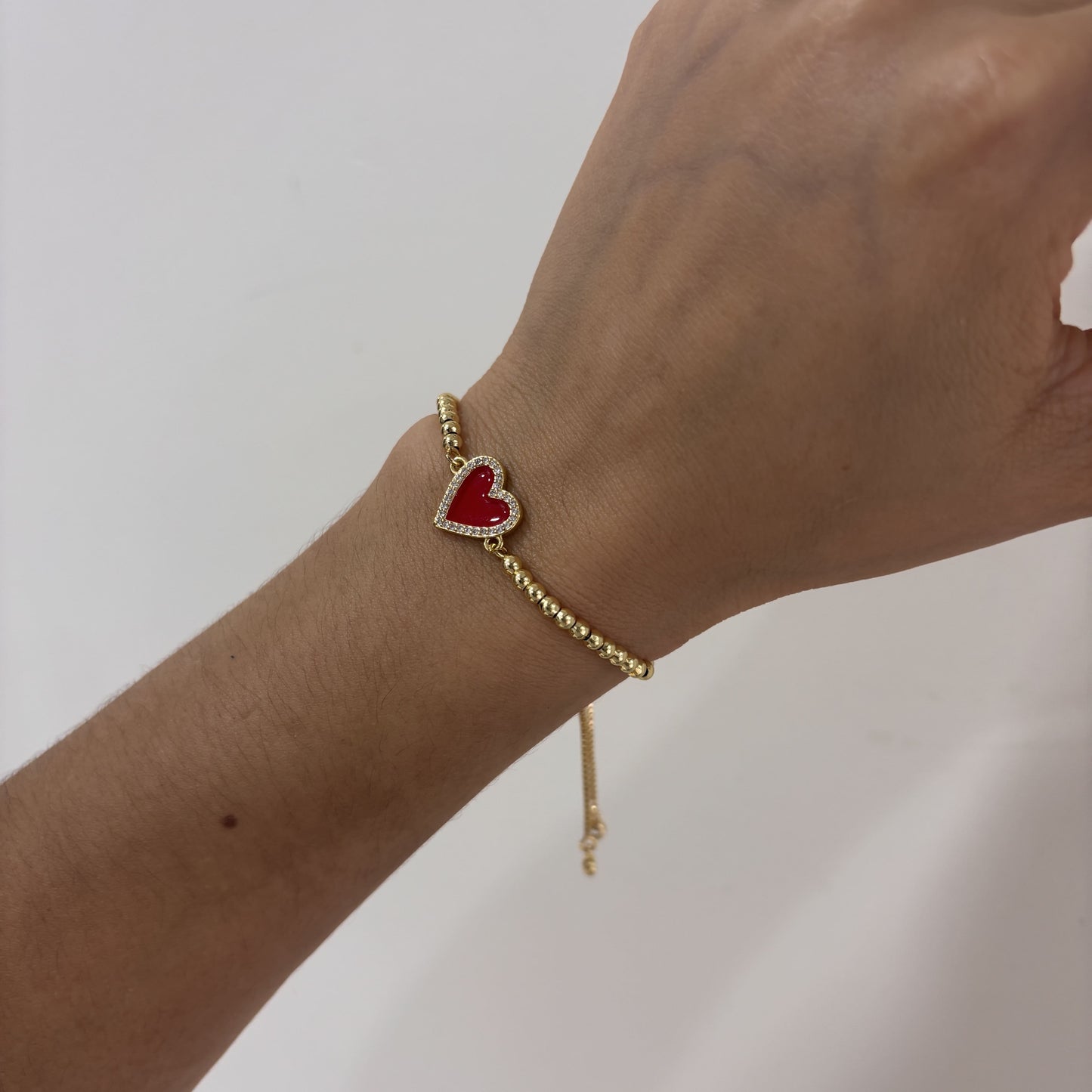 Pulsera ajustable corazón rojo zirconias chapa de oro
