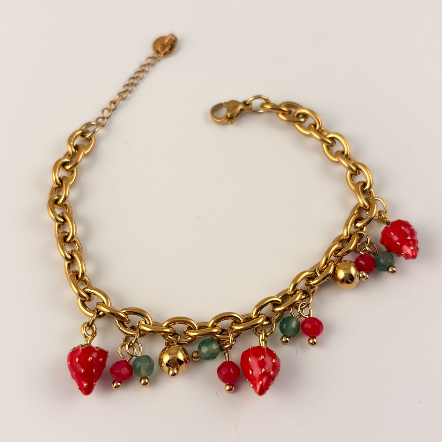 Pulsera charms de fresas acero inoxidable premium dorada