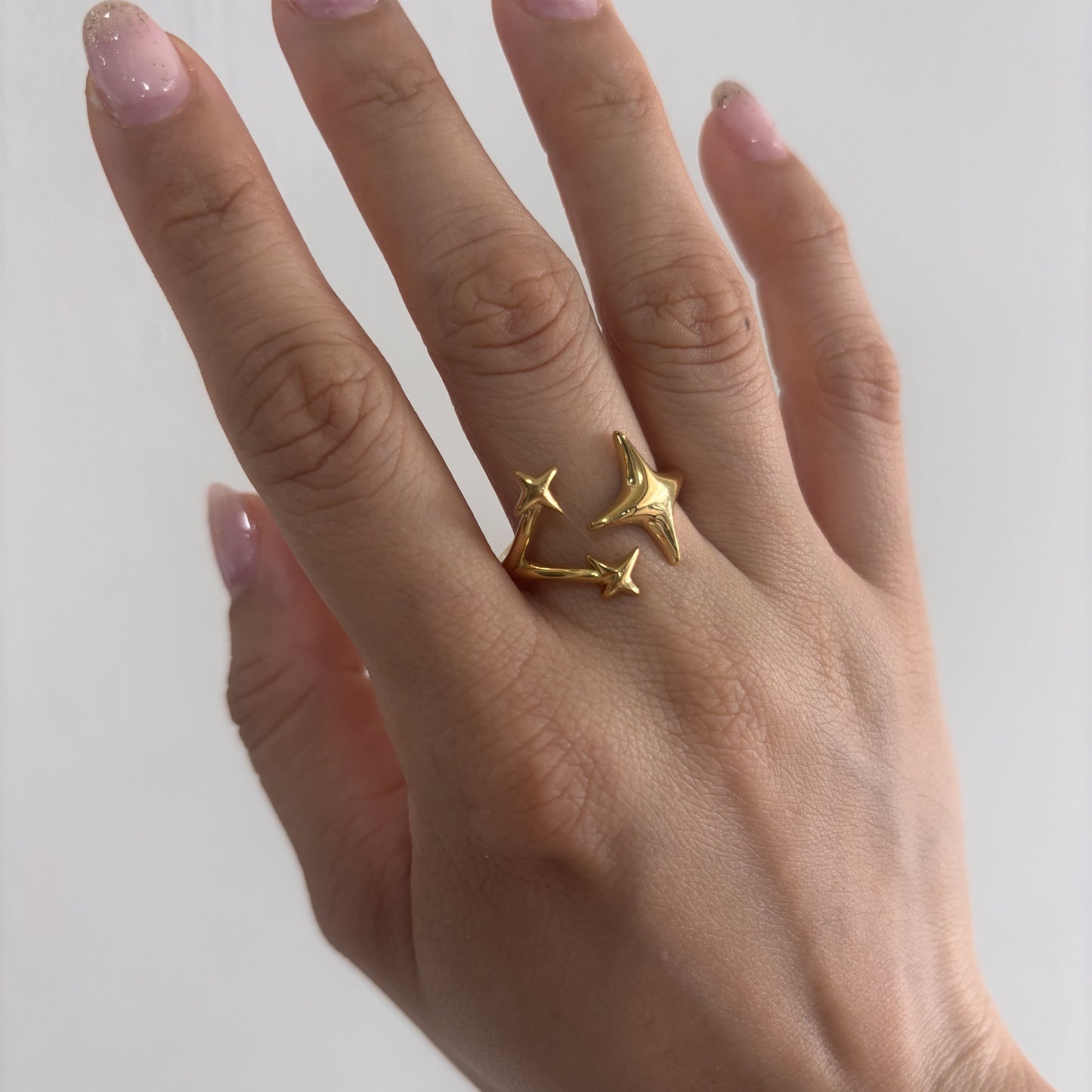 Anillo acero inoxidable destellos ajustable dorado
