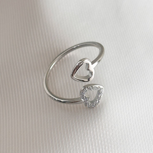 Anillo delgado acero inoxidable dos corazones zirconias
