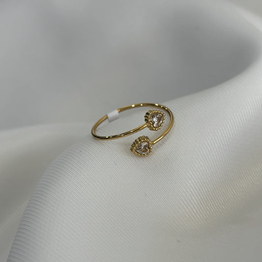 Anillo ajustable acero inoxidable dos corazones zirconias dorado