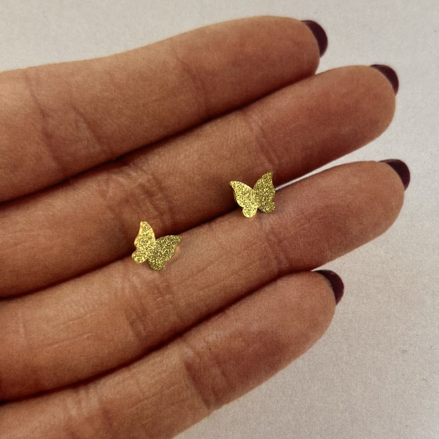 Broqueles mariposa acero inoxidable dorado distintos modelos