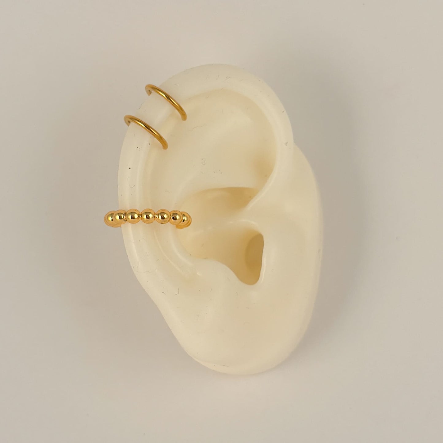 Simulador de perforación ear cuff doble acero inoxidable dorado