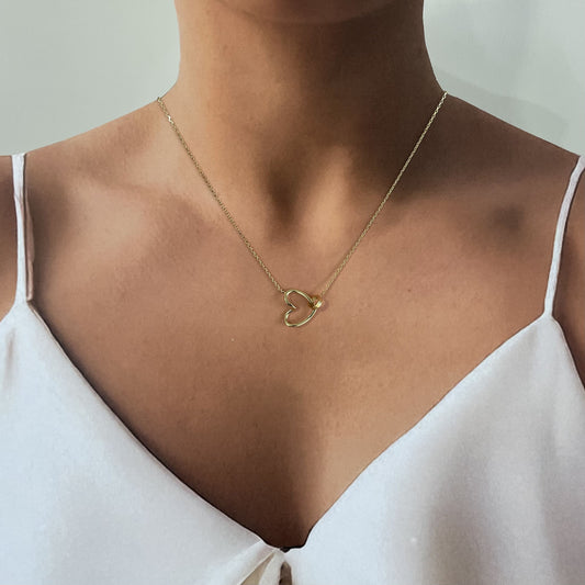 Collar acero inoxidable corazón aro dorado