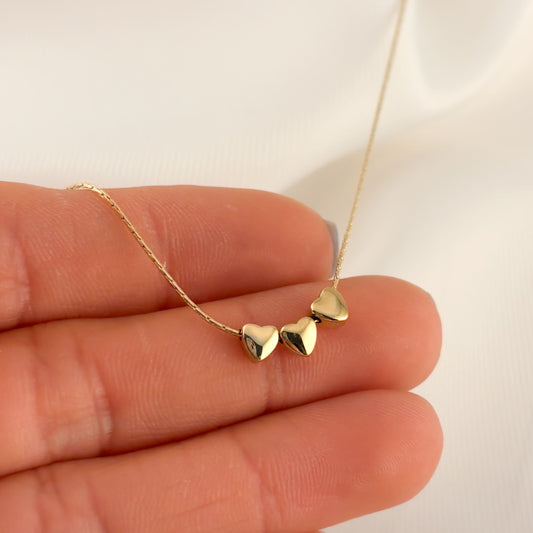 Collar acero inoxidable quirúrgico tres corazones dorado