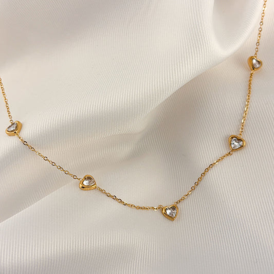 Collar acero inoxidable corazones zirconias dorado