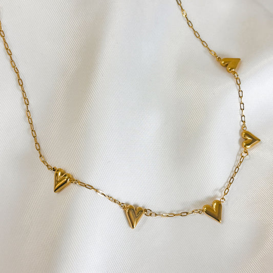 Collar acero inoxidable corazones alargados dorado