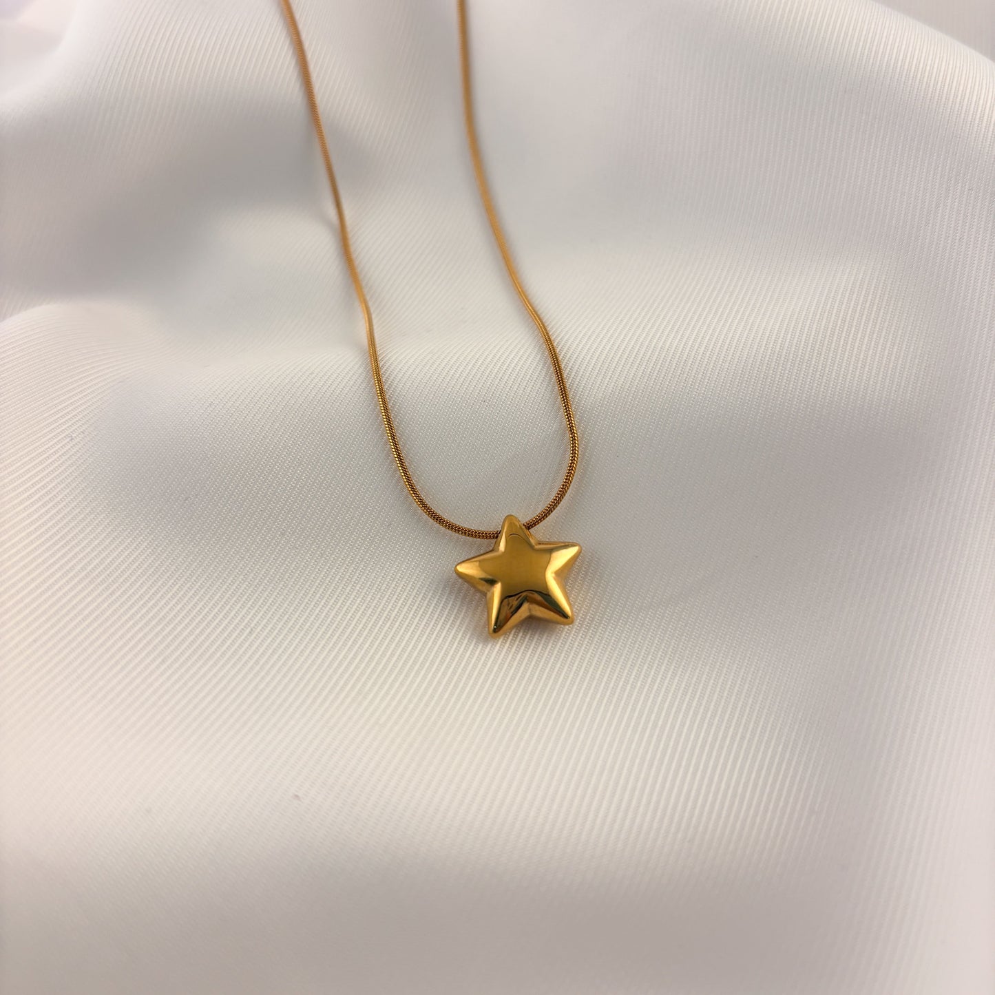 Collar estrella globo acero inoxidable dorado