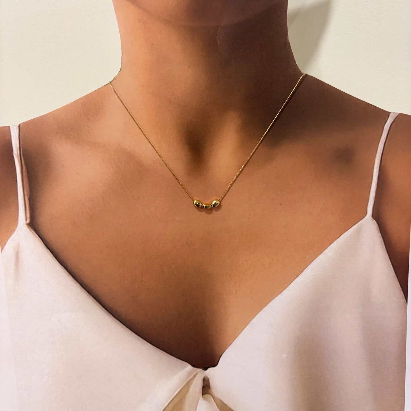 Collar tres semillas acero inoxidable dorado