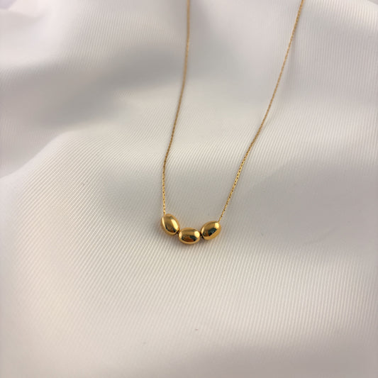Collar tres semillas acero inoxidable dorado