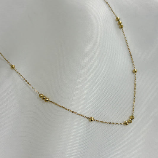 Collar acero inoxidable dorado bolitas dispar