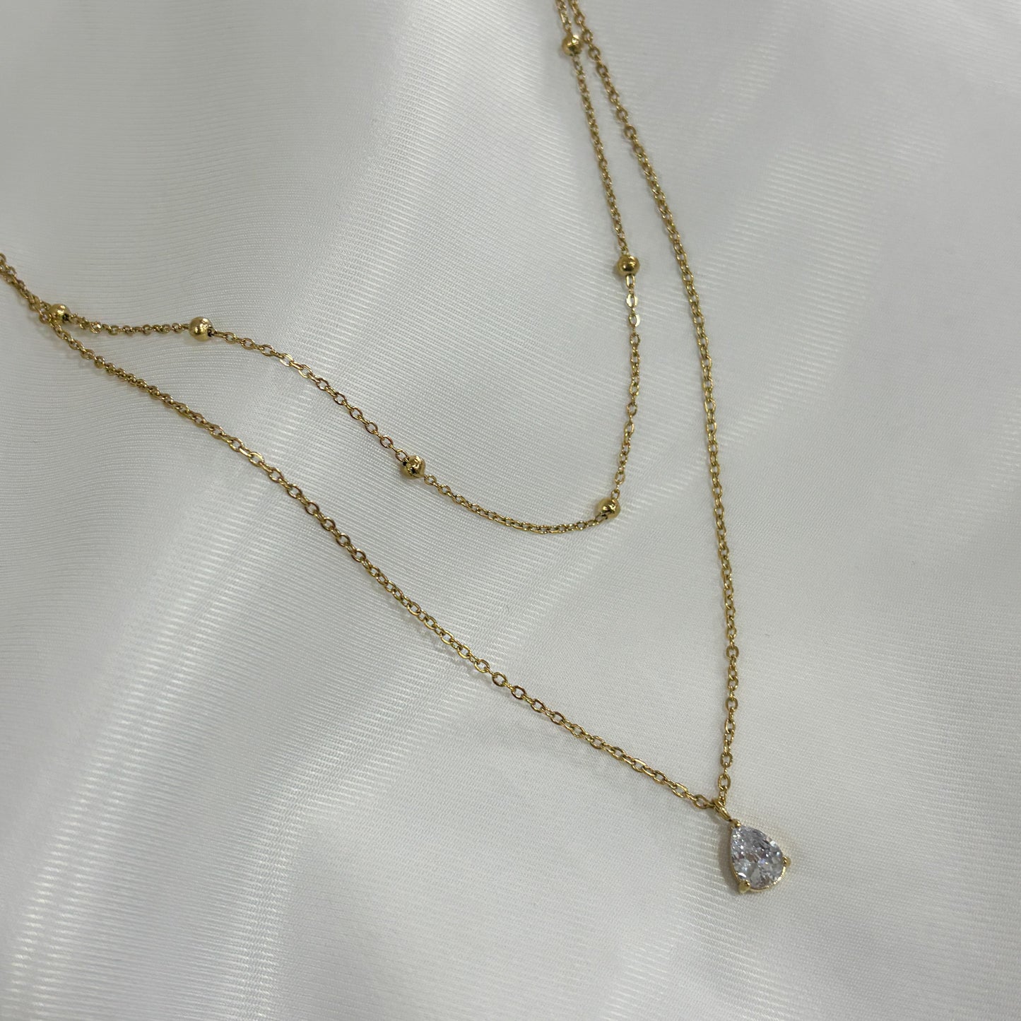 Collar doble acero inoxidable dorado bolitas zirconia gota