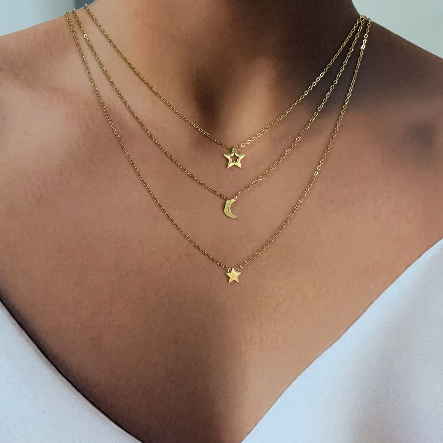 Collar triple acero inoxidable luna estrellas dorado