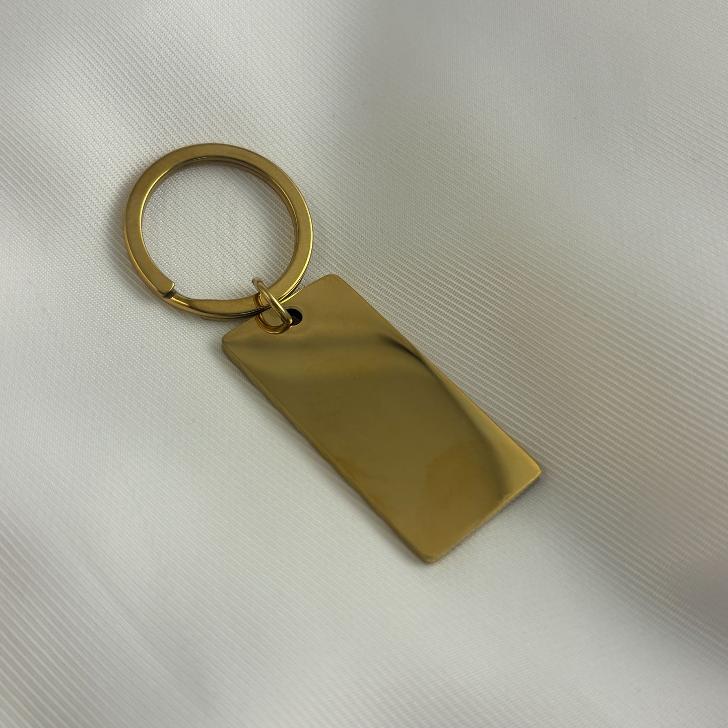 Llavero rectagular acero inoxidable dorado