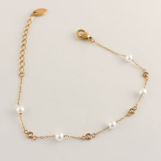 Pulsera acero inoxidable delgada perlas zirconias dorada