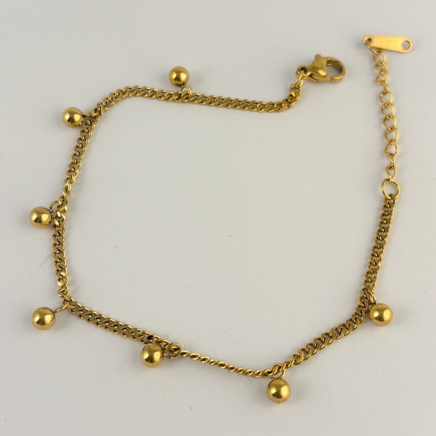 Pulsera acero inoxidable bolitas colgantes dorado