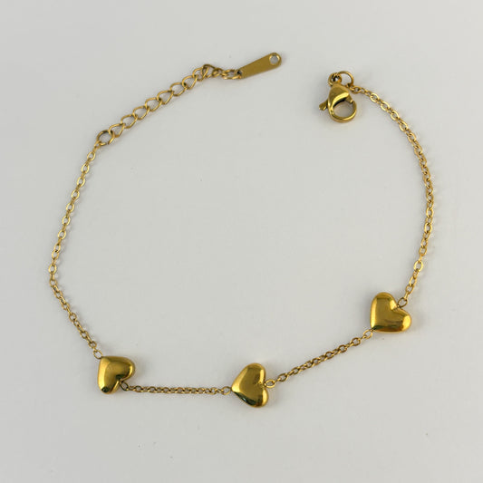 Pulsera acero inoxidable tres corazones globo dorado