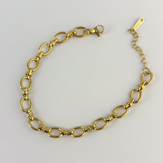 Pulsera acero inoxidable dorada aros nudos