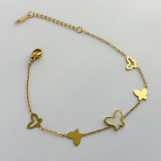 Pulsera acero inoxidable mariposas madre perla dorado