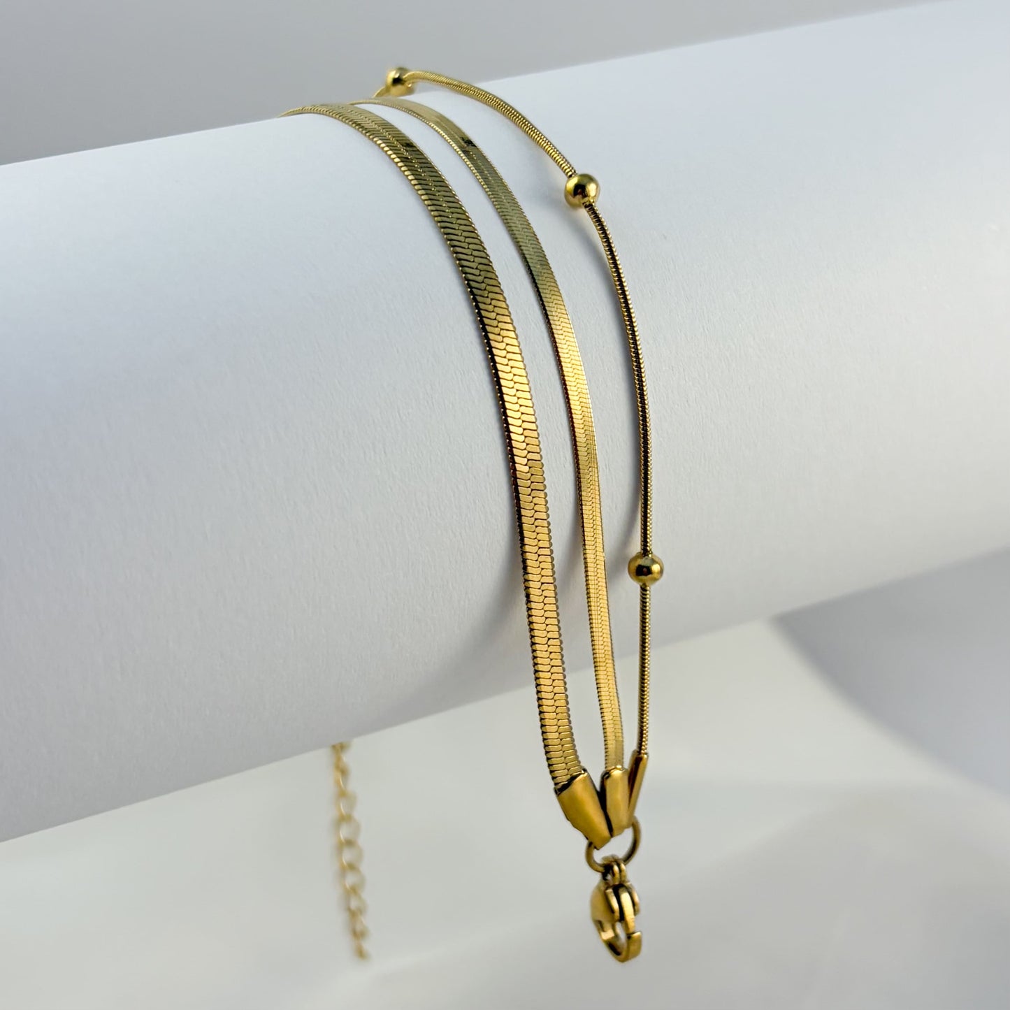 Pulsera triple acero inoxidable planchada bolitas dorado