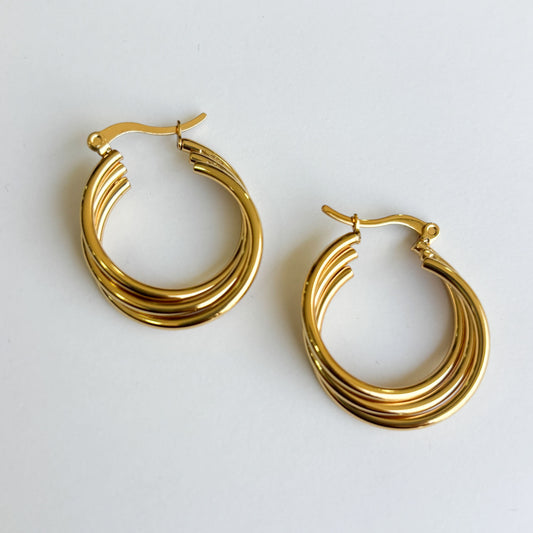 Arracadas triples cruzadas acero inoxidable dorado