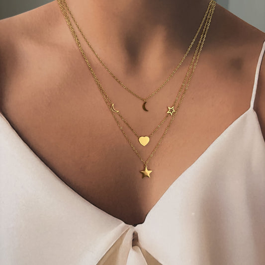 Set aretes y collar triple acero inoxidable corazón estrella luna dorado