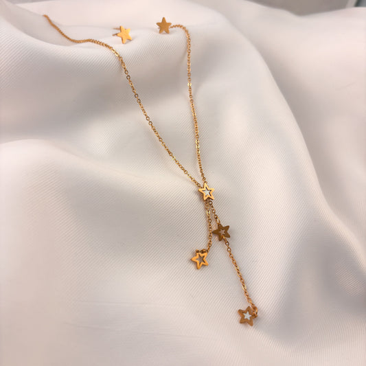 Set aretes y collar acero inoxidable estrellas corbatín madre perla dorado