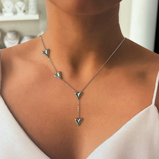 Set collar con aretes acero inoxidable corazones alargados