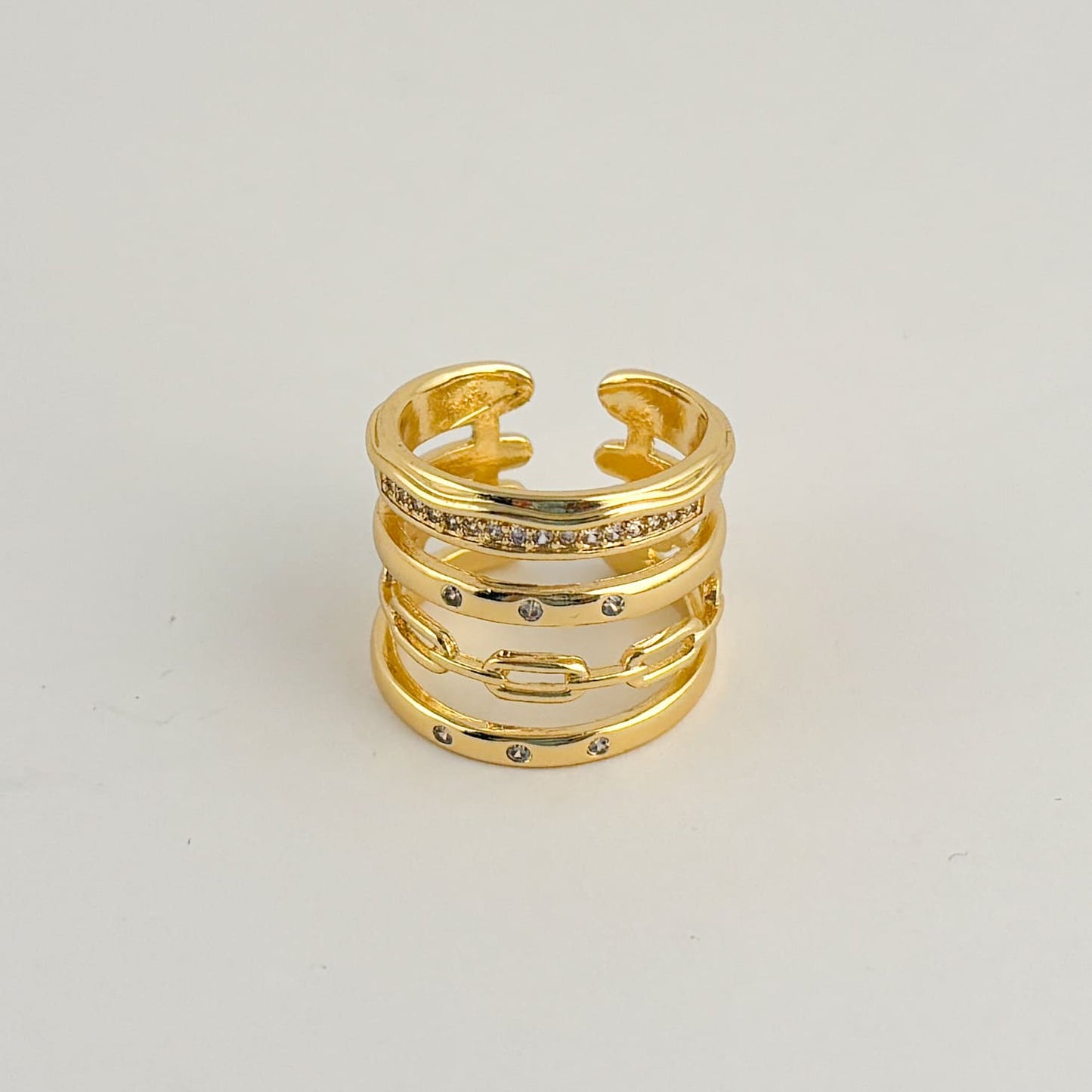 Anillo grueso 5 anillos zirconias chapa de oro