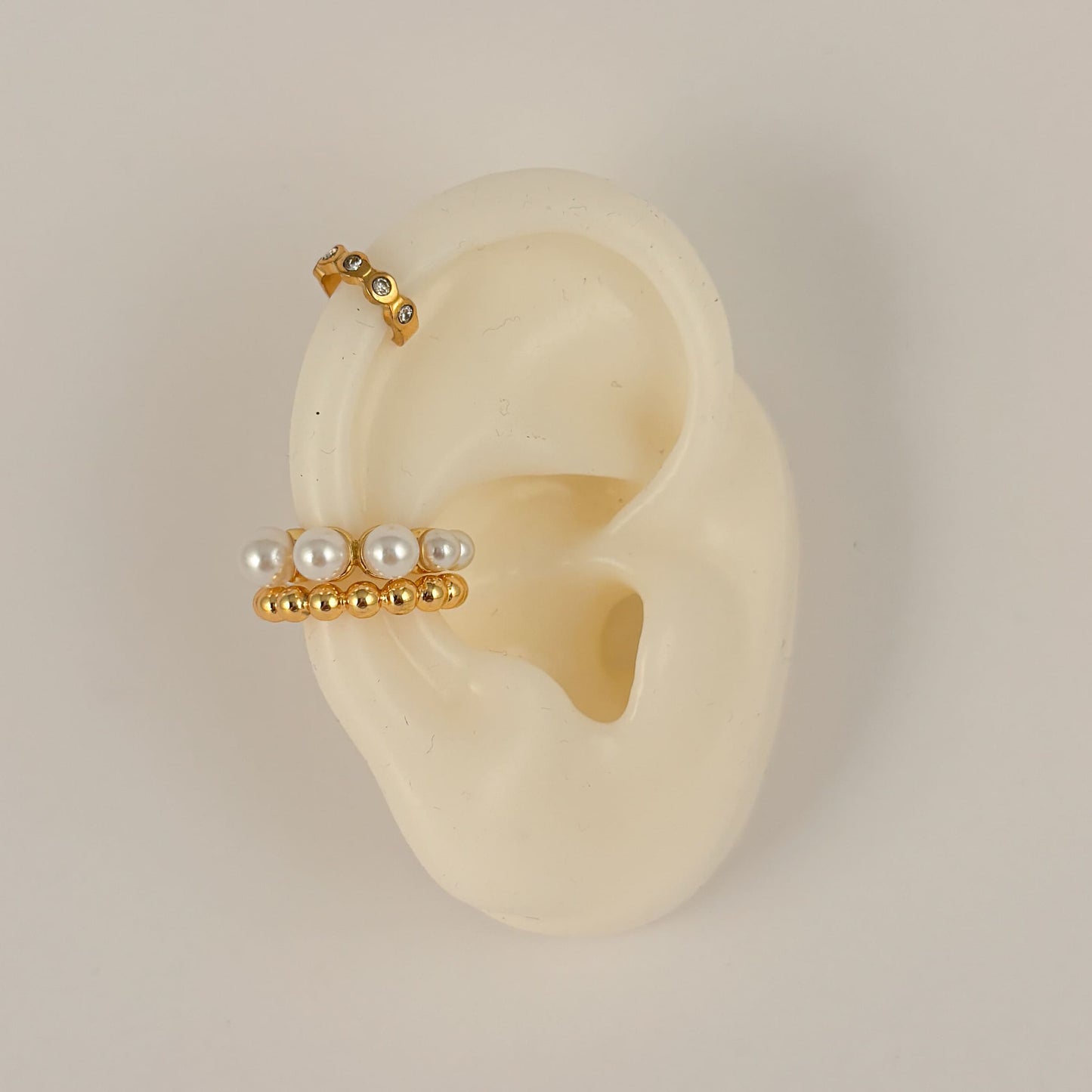 Simulador de perforación ear cuff mini zirconias acero inoxidable dorado