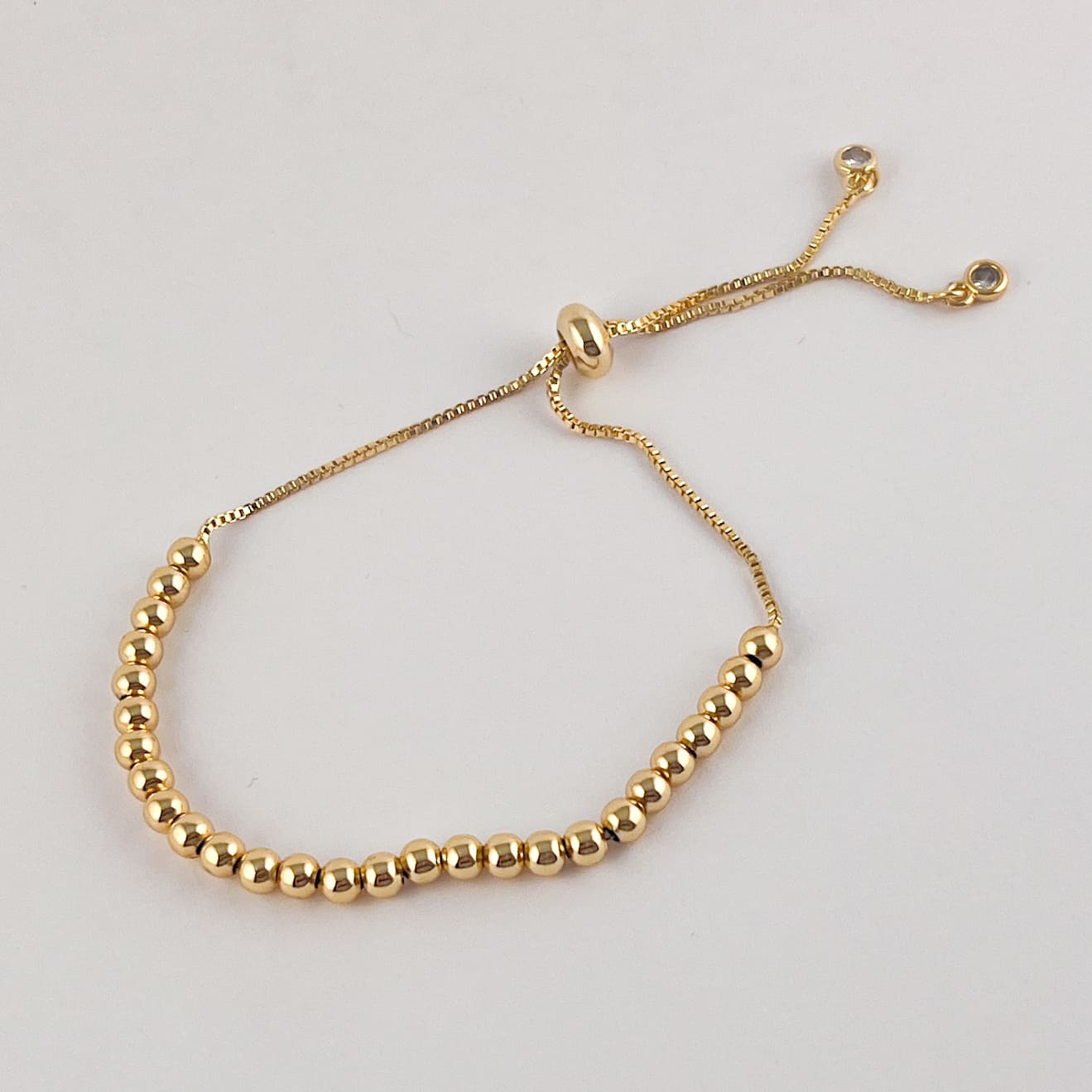 Pulsera bolitas chapa de oro ajustable 4 mm