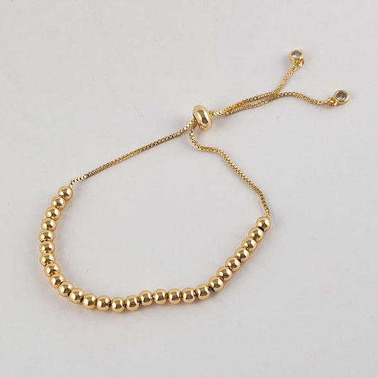 Pulsera bolitas chapa de oro ajustable 4 mm