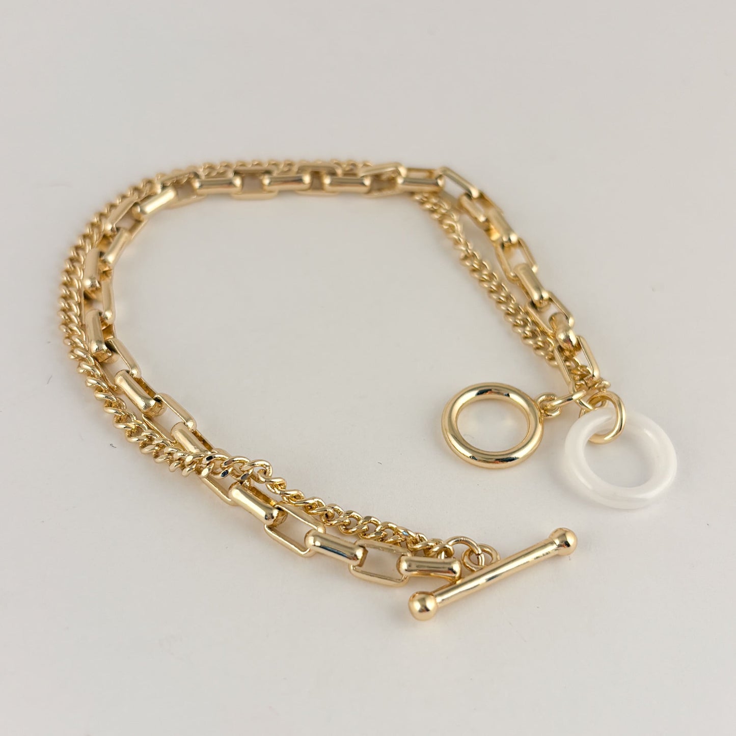 Pulsera chapa de oro doble cadena broche T aro blanco