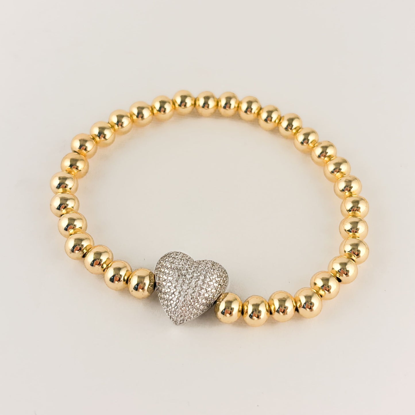 Pulsera bolitas chapa de oro corazón plateado zirconias