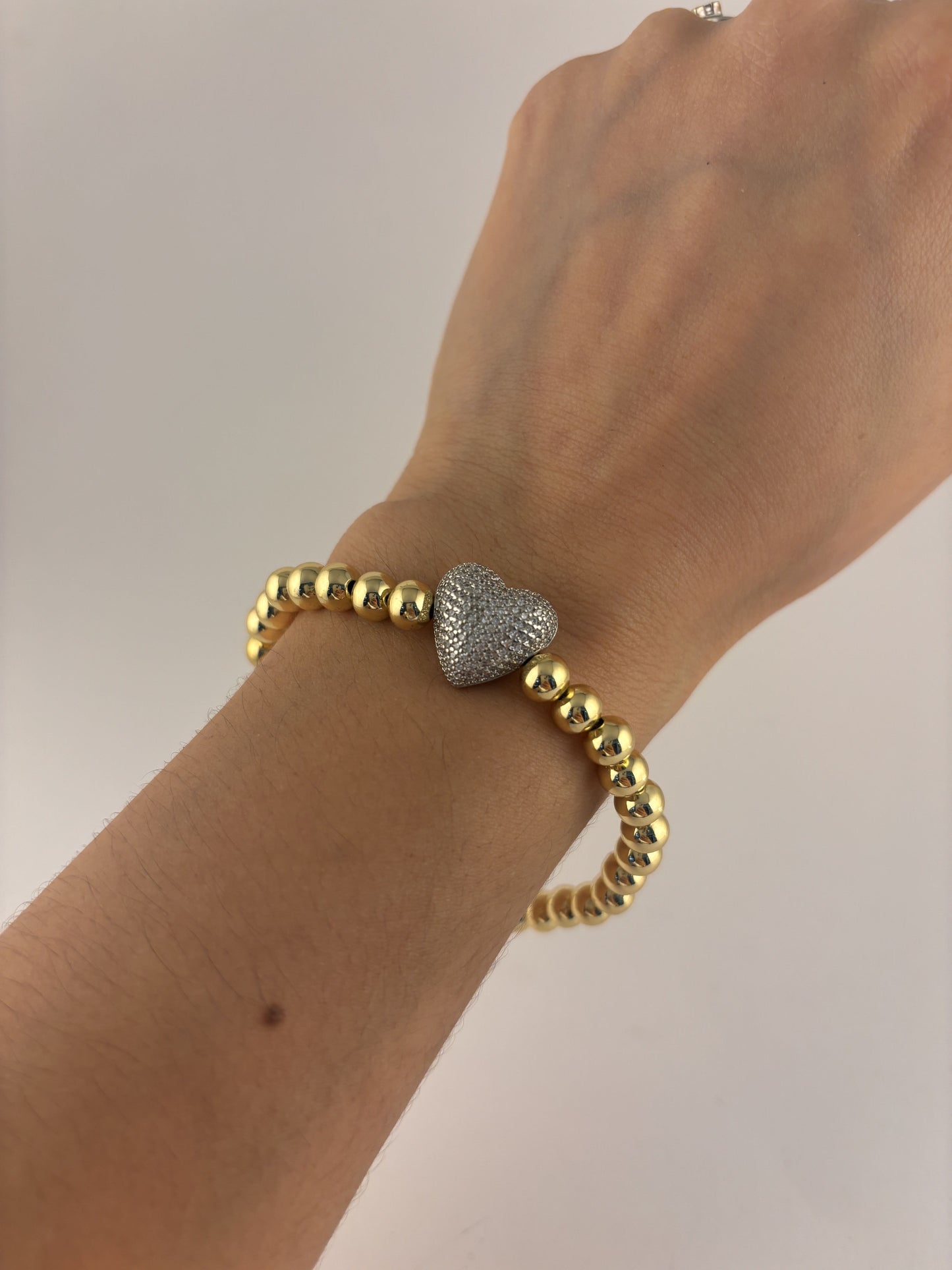 Pulsera bolitas chapa de oro corazón plateado zirconias