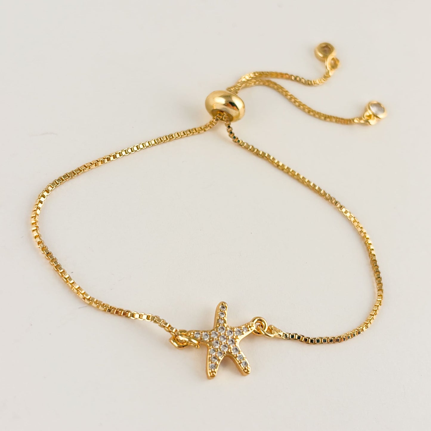 Pulsera estrella de mar chapa de oro ajustable zirconias