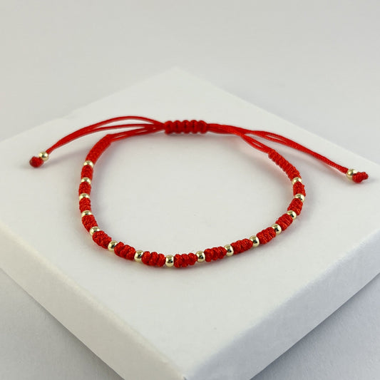 Pulsera hilo rojo bolitas chapa de oro