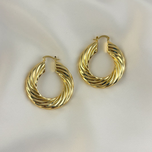 Arracadas textura curva maxi chapa de oro