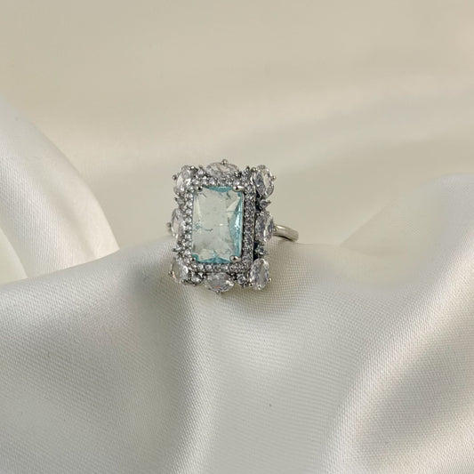 Anillo ajustable plateado zirconias azul claro cuadro
