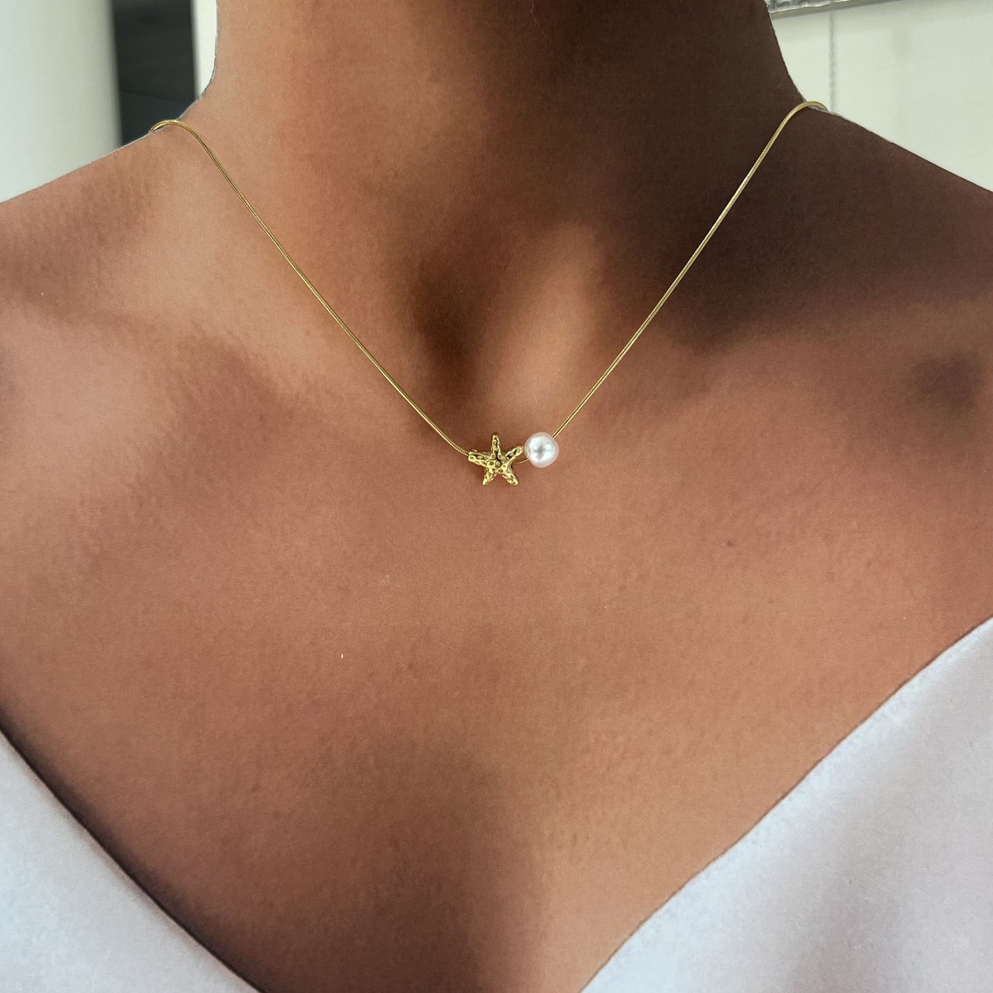 Collar perla estrellita de mar dorado acero inoxidable premium