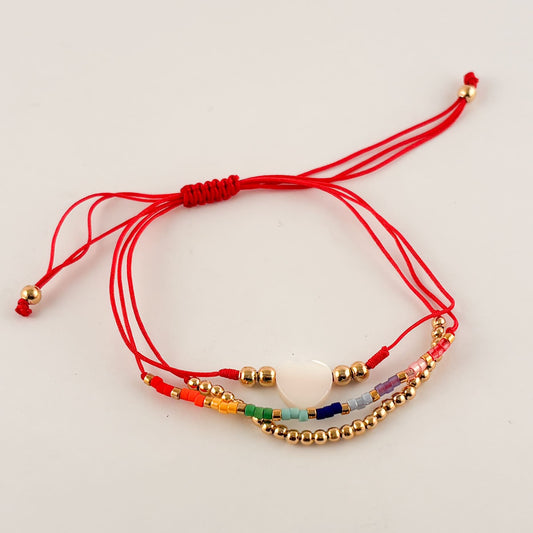 Pulsera triple hilo ajustable chapa de oro corazón madre perla miyuki de colores