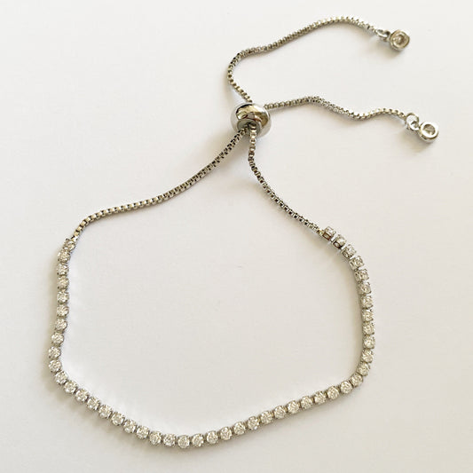 Pulsera ajustable fila cristales chapa de oro tono plateado