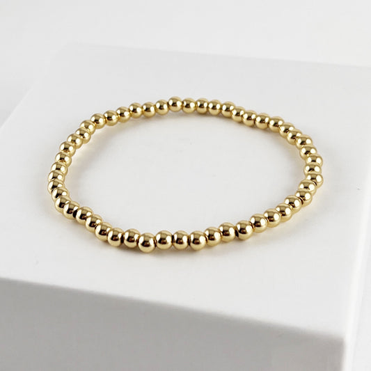 Pulsera esferitas chapa de oro dorada elástico